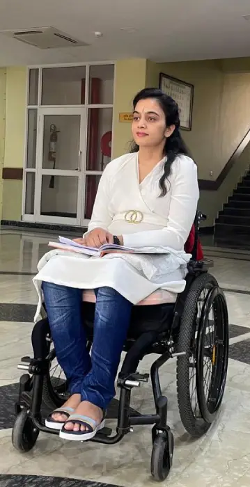 A student using a wheelchair at the University of Patanjali campus, showcasing accessible facilities for all students